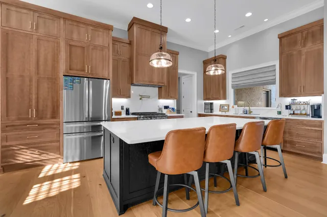 a kitchen with stainless steel appliances a sink dishwasher window and cabinets