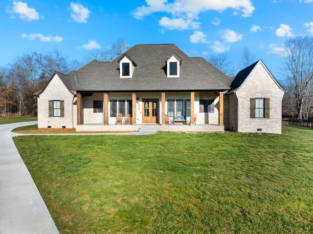 a front view of a house with a yard