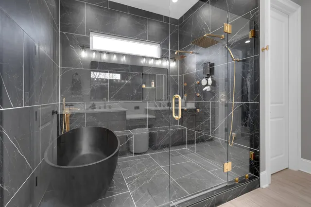 a bathroom with a sink toilet a shower and a mirror