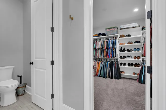 a view of a livingroom with gym equipment and a chandelier