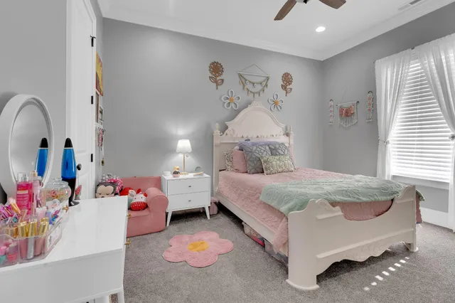 a view of a porch with furniture and garden