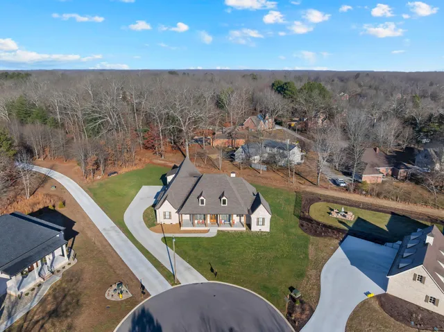 a bedroom with furniture window and wooden floor