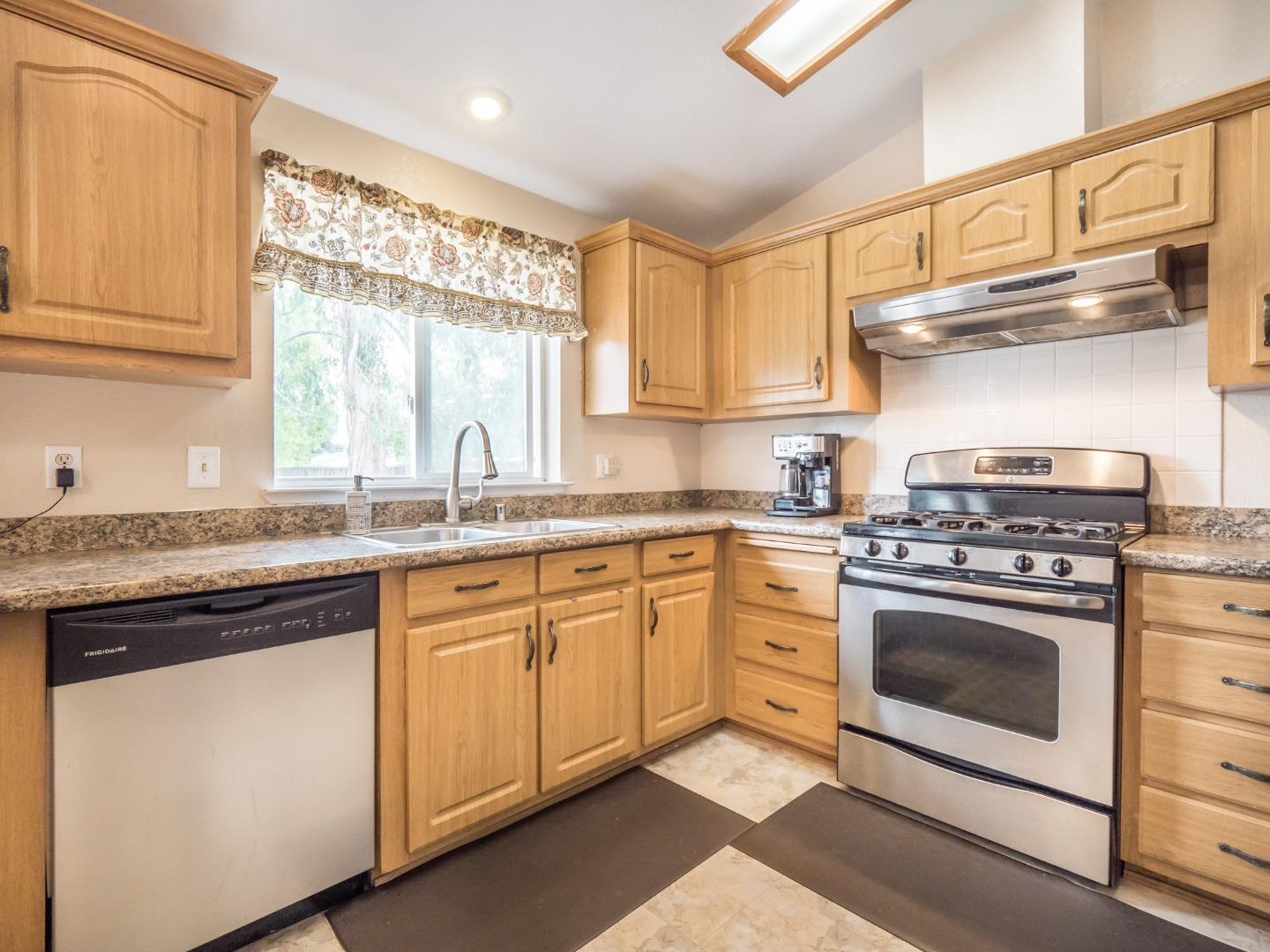 9 Dick Phelps Road Watsonville, CA 95076 - Photo 15 of 32 a kitchen with stainless steel appliances granite countertop a sink and a stove