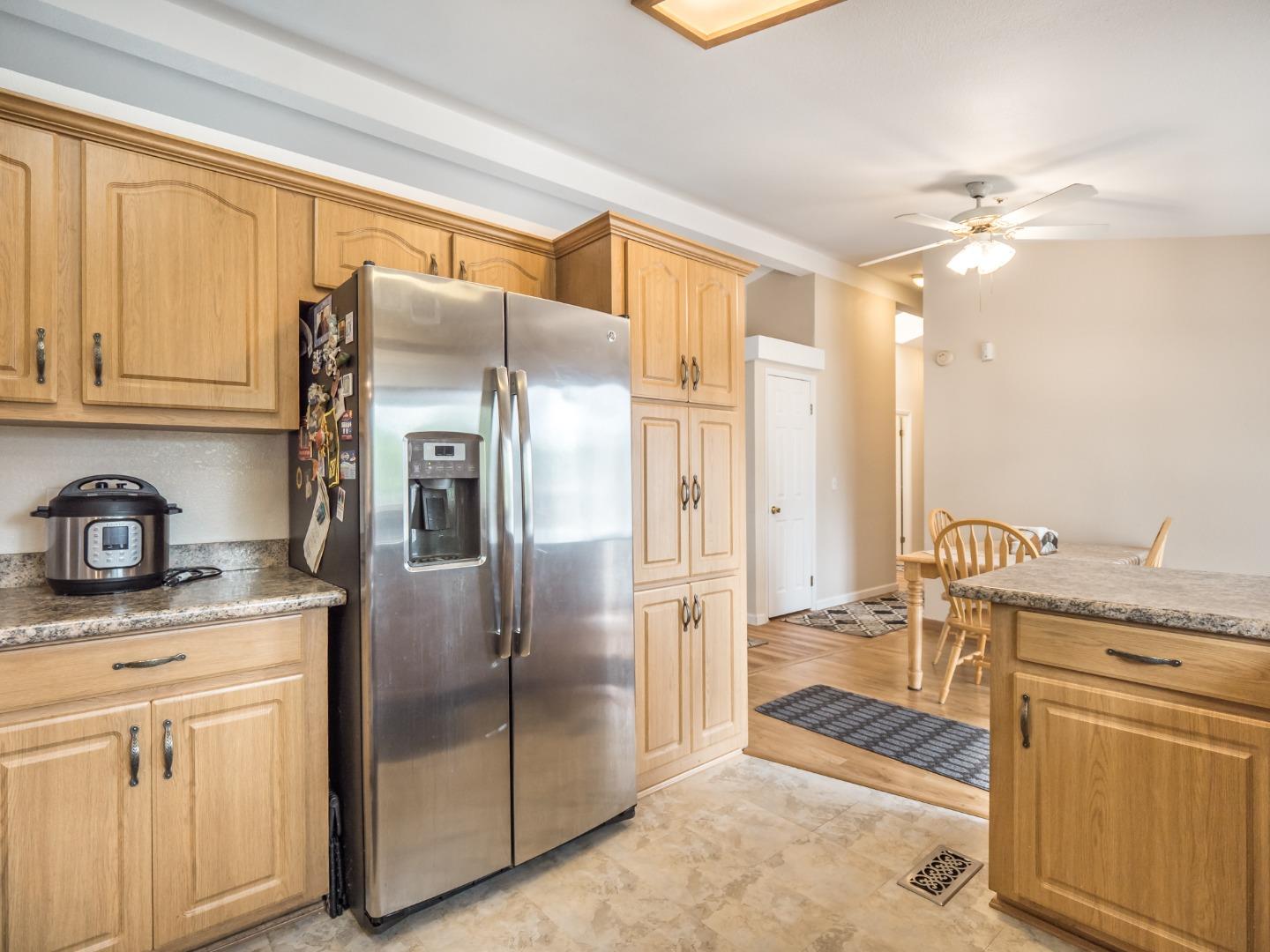 9 Dick Phelps Road Watsonville, CA 95076 - Photo 16 of 32 a kitchen with stainless steel appliances granite countertop a refrigerator and a stove top oven