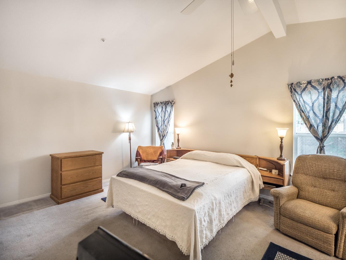 9 Dick Phelps Road Watsonville, CA 95076 - Photo 17 of 32 a bedroom with a bed and a couch