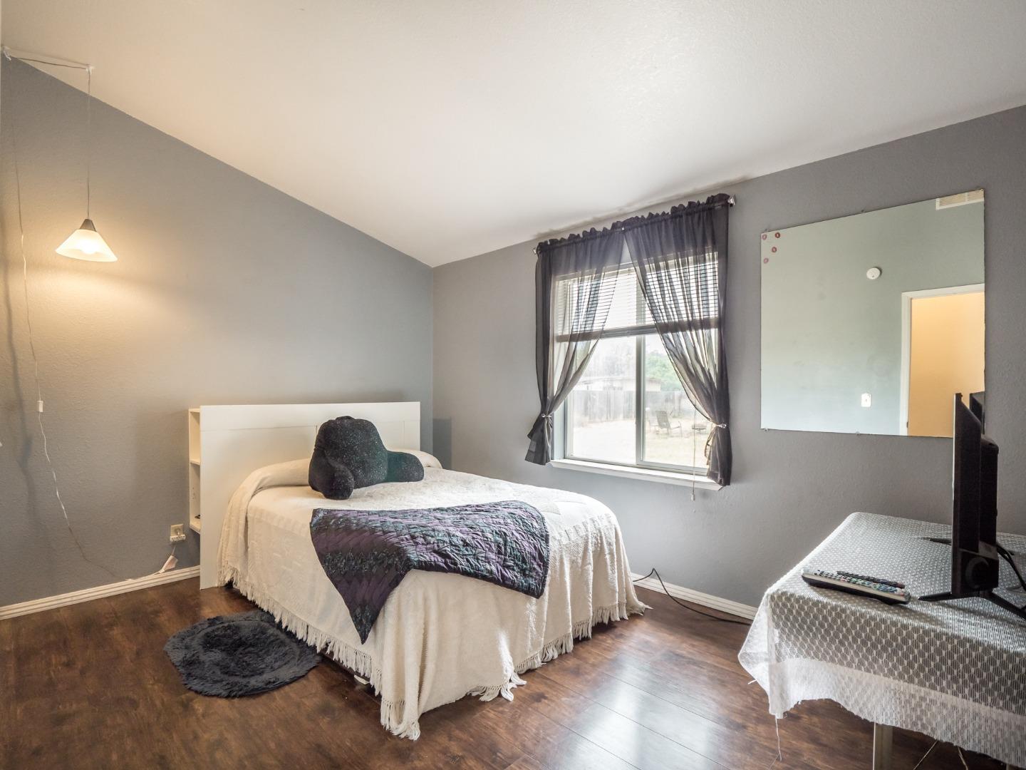 9 Dick Phelps Road Watsonville, CA 95076 - Photo 18 of 32 a bedroom with a bed and a window