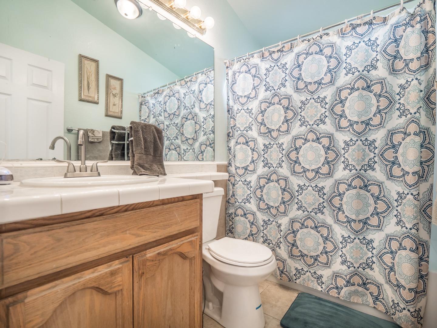 9 Dick Phelps Road Watsonville, CA 95076 - Photo 22 of 32 a bathroom with a sink toilet and shower