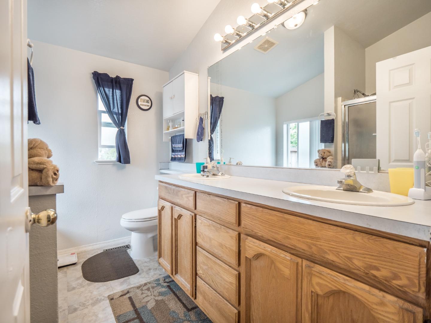 9 Dick Phelps Road Watsonville, CA 95076 - Photo 25 of 32 a bathroom with a sink and a mirror