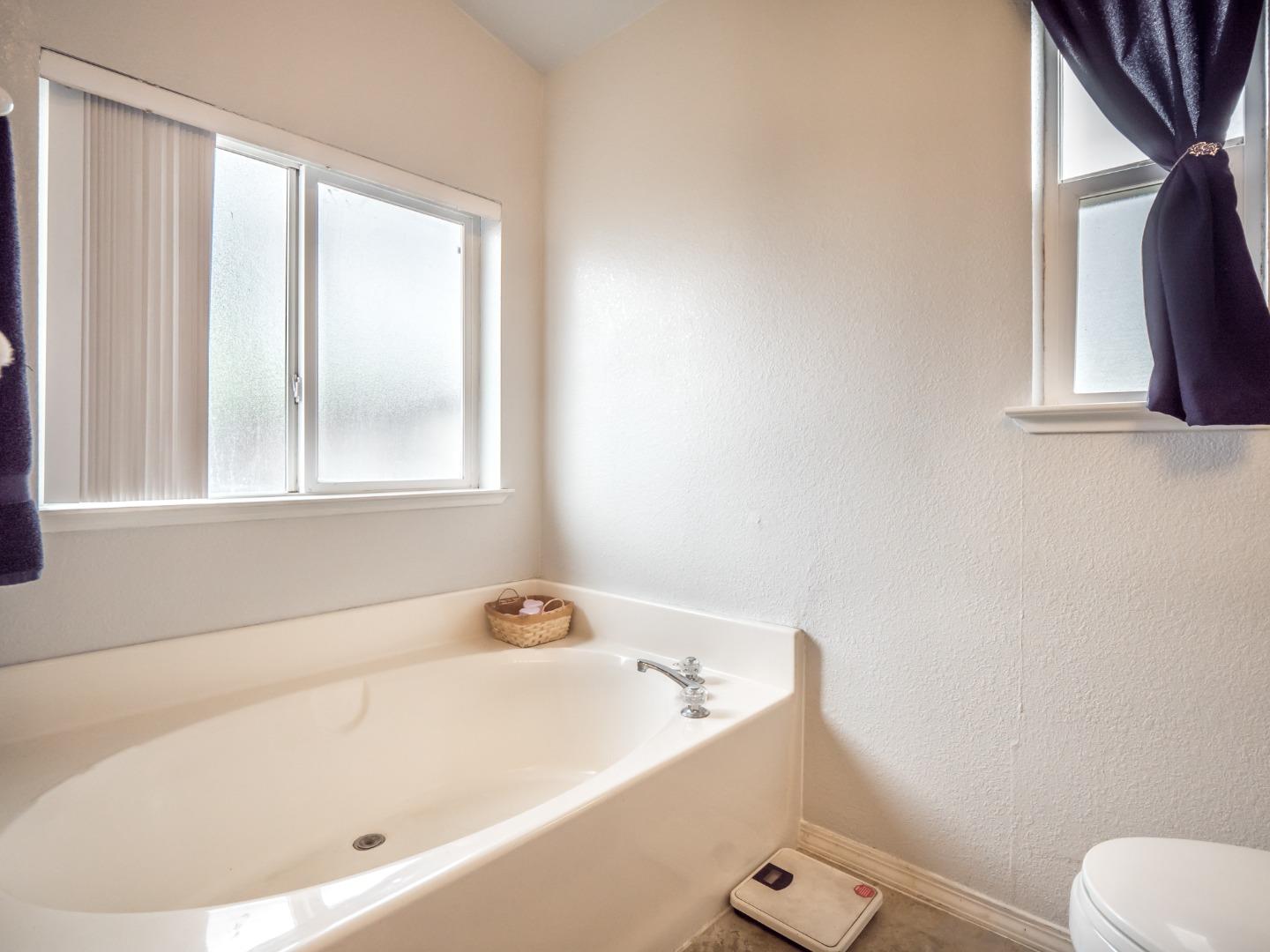 9 Dick Phelps Road Watsonville, CA 95076 - Photo 26 of 32 a white bath tub sitting next to a window