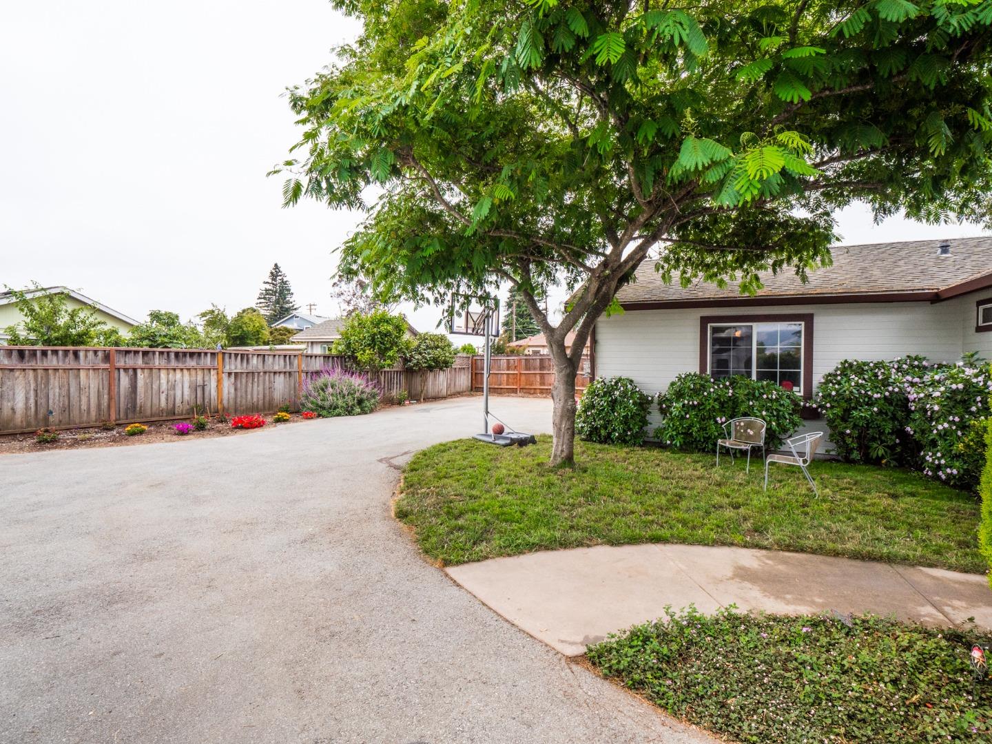 9 Dick Phelps Road Watsonville, CA 95076 - Photo 4 of 32 a white house with a large tree in the background