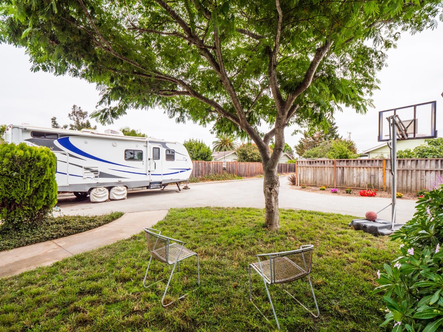 9 Dick Phelps Road Watsonville, CA 95076 - Photo 5 of 32 a white house with trees in front of it