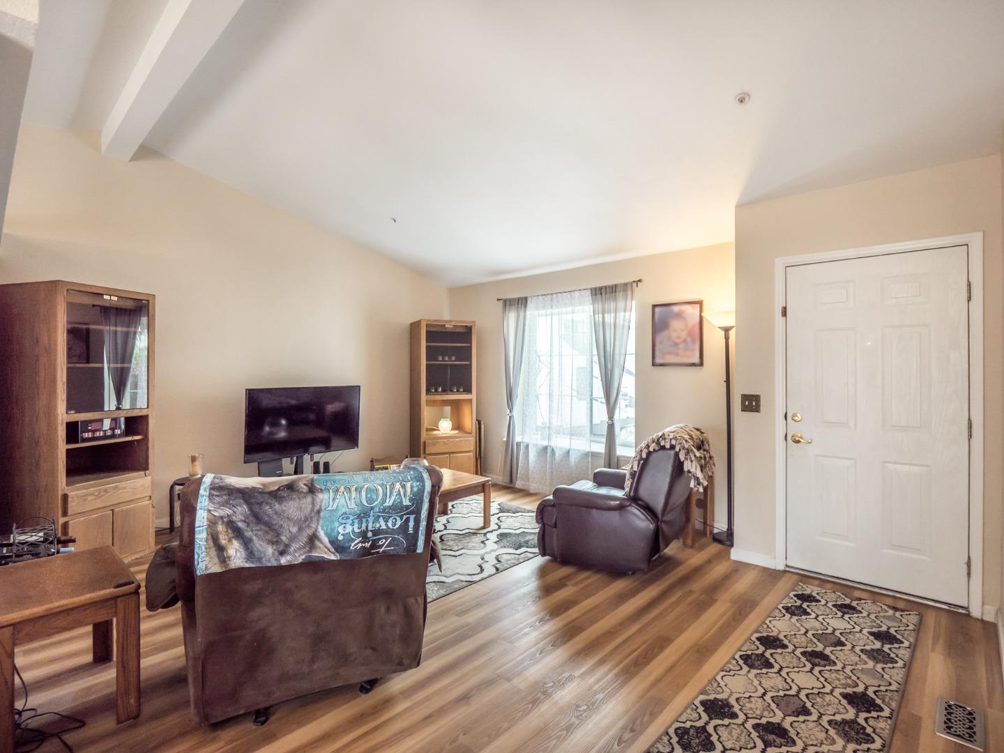 9 Dick Phelps Road Watsonville, CA 95076 - Photo 6 of 32 a living room with furniture and a flat screen tv