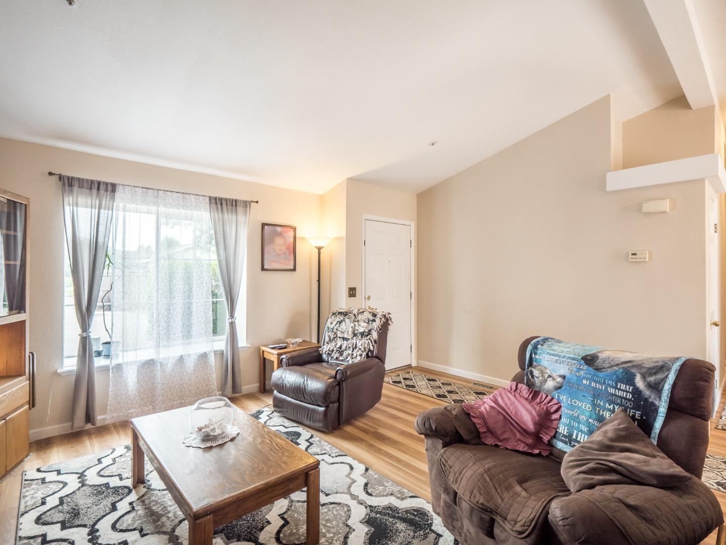 9 Dick Phelps Road Watsonville, CA 95076 - Photo 10 of 32 a living room with furniture and a large window