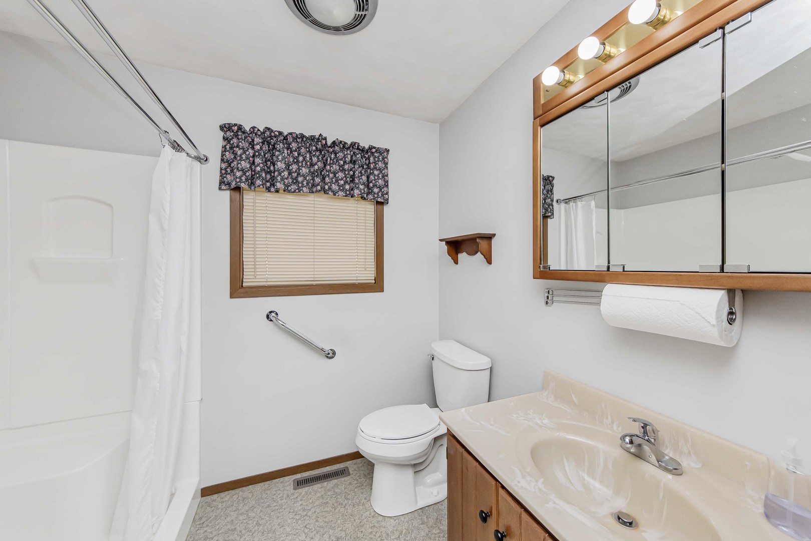 313 West Topeka Street Toluca, IL 61369 - Photo 20 of 32 a bathroom with a toilet sink and mirror