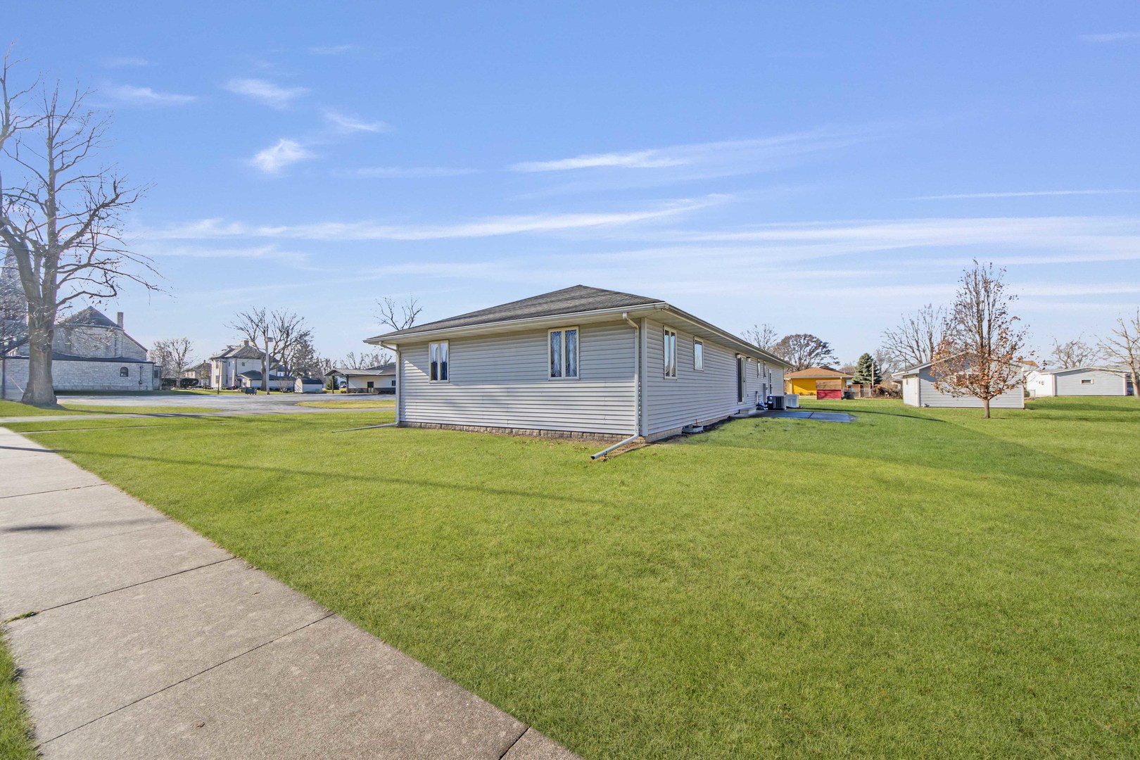 313 West Topeka Street Toluca, IL 61369 - Photo 25 of 32 a front view of a house with garden and trees