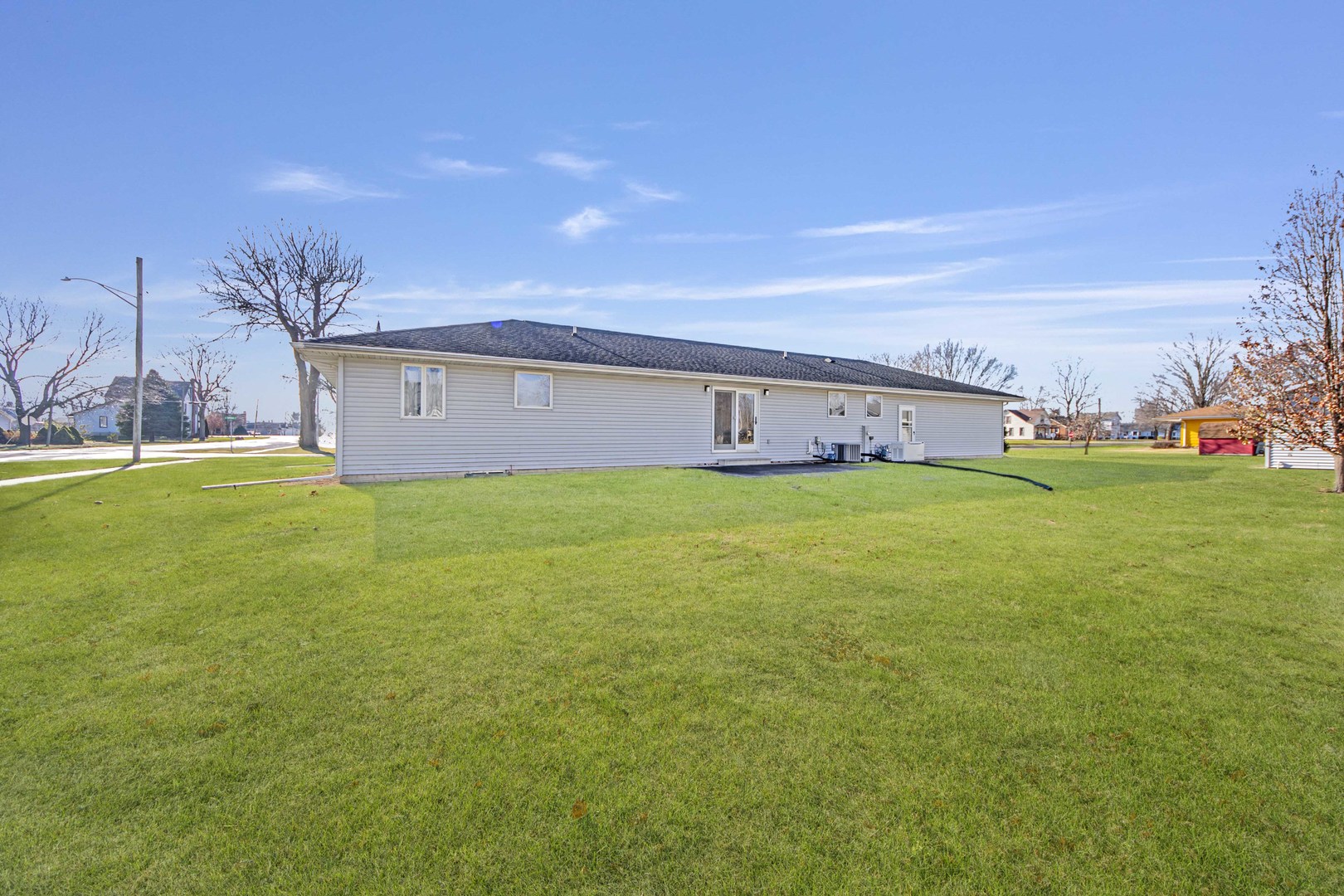 313 West Topeka Street Toluca, IL 61369 - Photo 26 of 32 a view of a house with a big yard and large trees