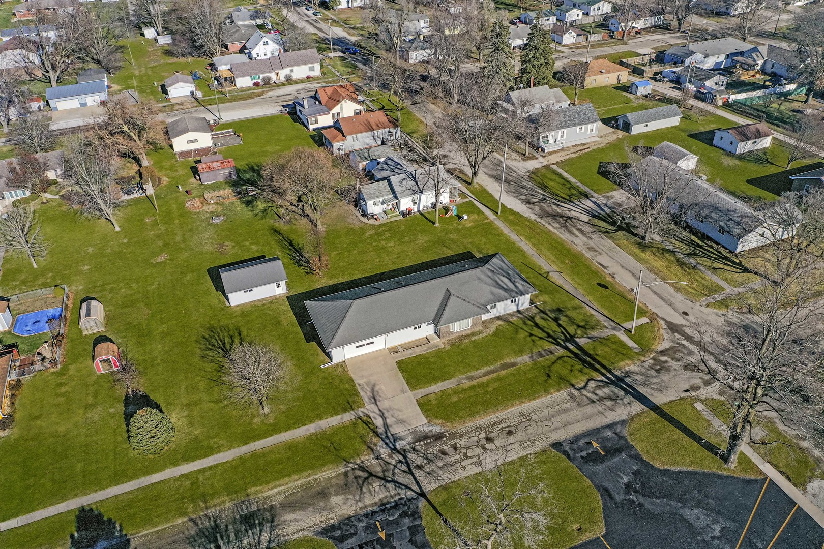 313 West Topeka Street Toluca, IL 61369 - Photo 31 of 32 an aerial view of a pool patio chairs and fire pit