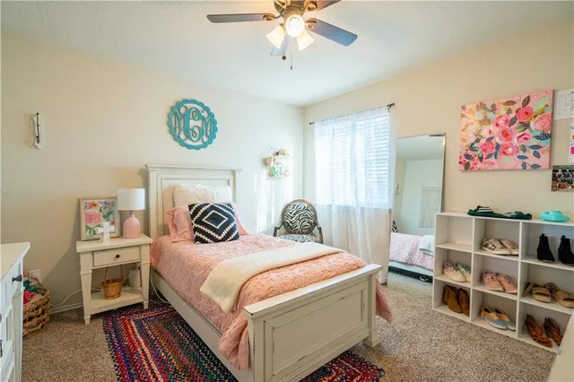 a living room with furniture and windows