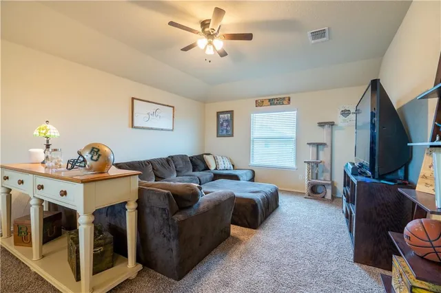 a view of a house with wooden fence