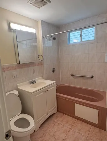 a bathroom with a sink a toilet and a bathtub