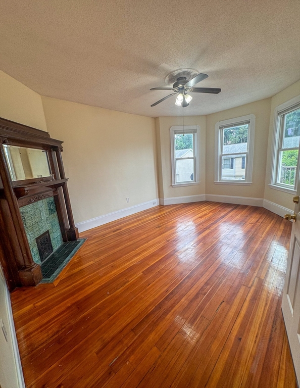 35 Hollander Street, Unit 2 Boston, MA 02121 - Photo 2 of 17 a view of empty room with wooden floor and fan