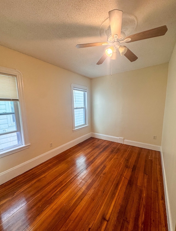 35 Hollander Street, Unit 2 Boston, MA 02121 - Photo 6 of 17 a view of an empty room with wooden floor and a window