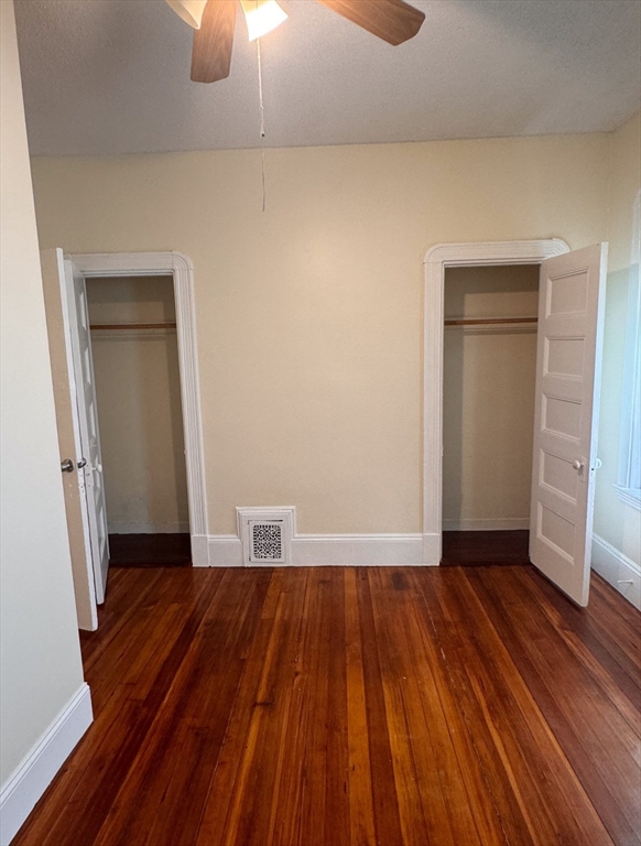 35 Hollander Street, Unit 2 Boston, MA 02121 - Photo 7 of 17 an empty room with wooden floor and a window