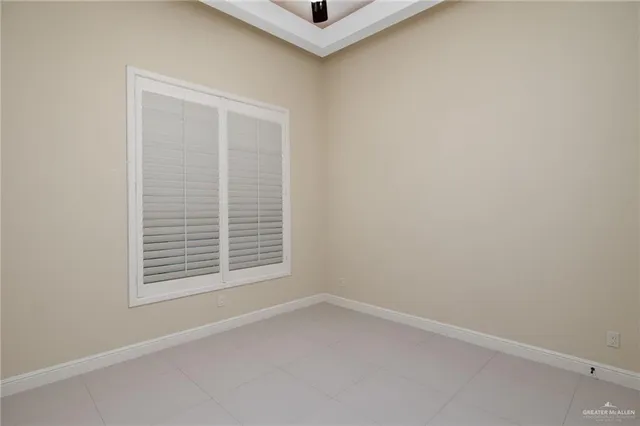 a view of an empty room and window