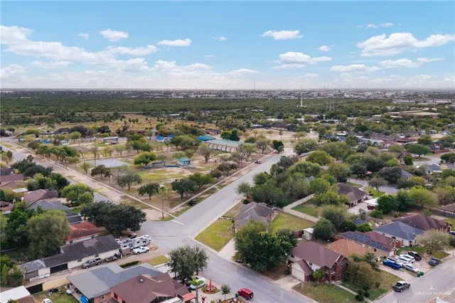 an aerial view of residential houses with outdoor space