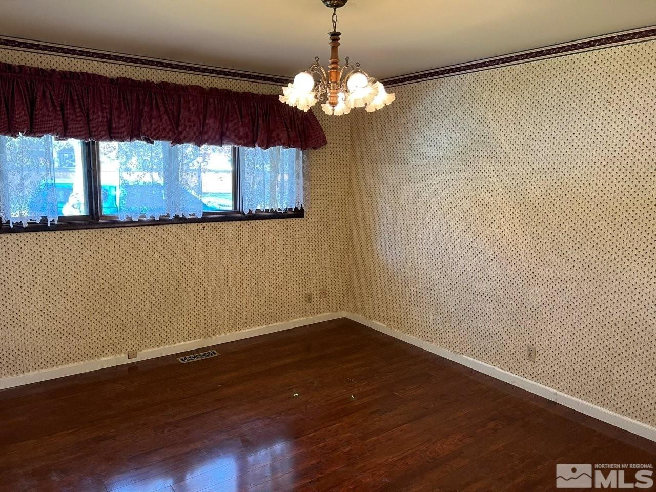 1840 Allen Street Reno, NV 89509 - Photo 13 of 20 a view of a room with wooden floor and large window