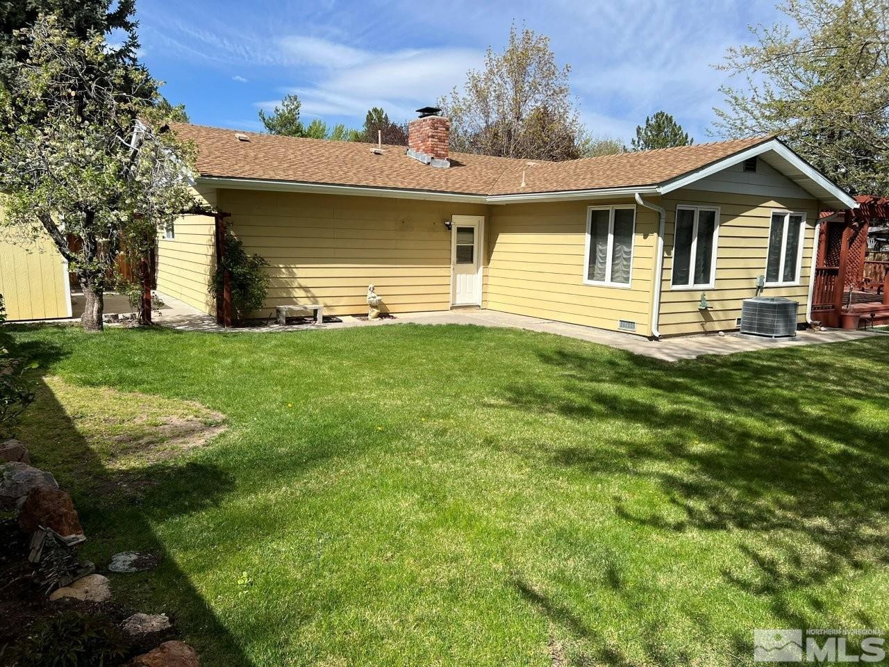 1840 Allen Street Reno, NV 89509 - Photo 15 of 20 a front view of a house with a garden