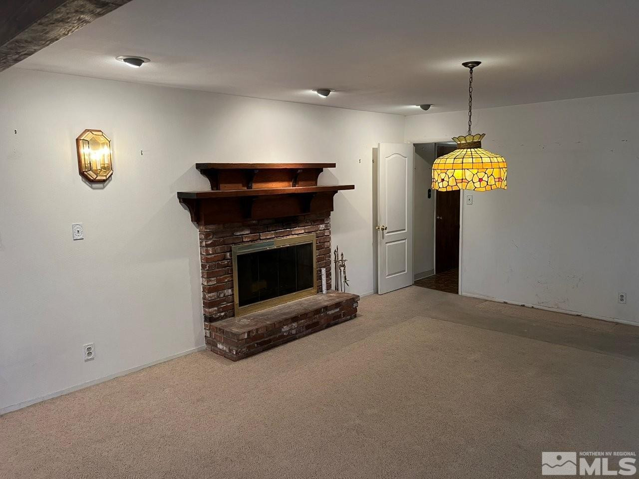 1840 Allen Street Reno, NV 89509 - Photo 4 of 20 a living room with furniture and a chandelier