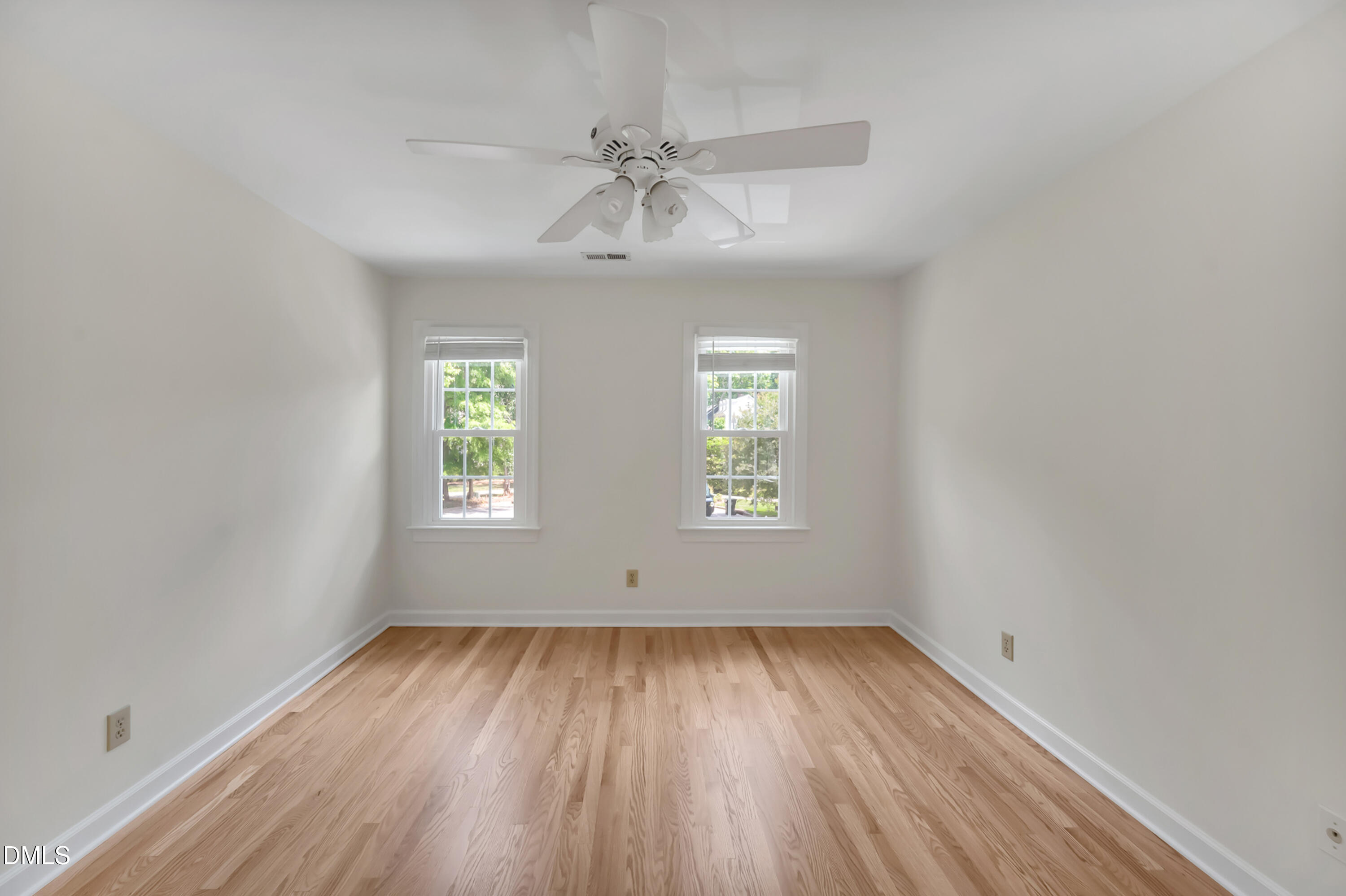 7500 Drayton Court Raleigh, NC 27615 - Photo 11 of 27 wooden floor in an empty room with a window