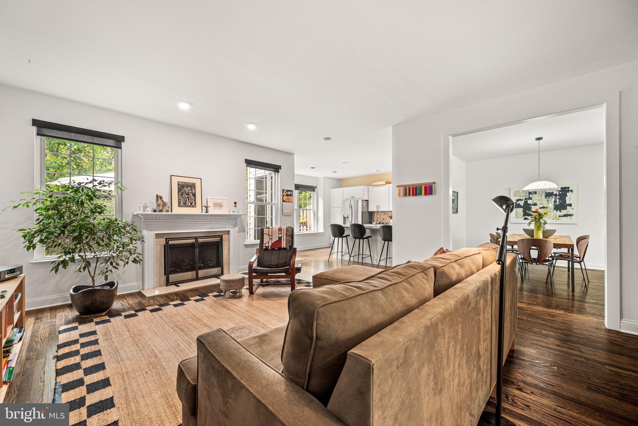 102 Dundee Mills Lane Wallingford, PA 19086 - Photo 11 of 43 a living room with furniture a fireplace and a potted plant