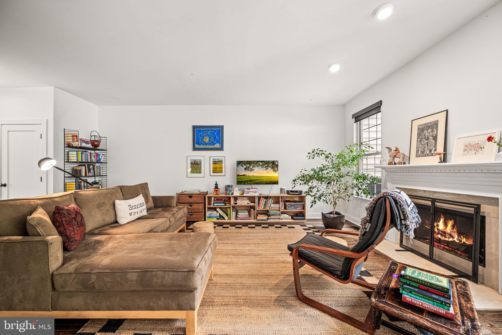 102 Dundee Mills Lane Wallingford, PA 19086 - Photo 13 of 43 a living room with furniture and a fireplace