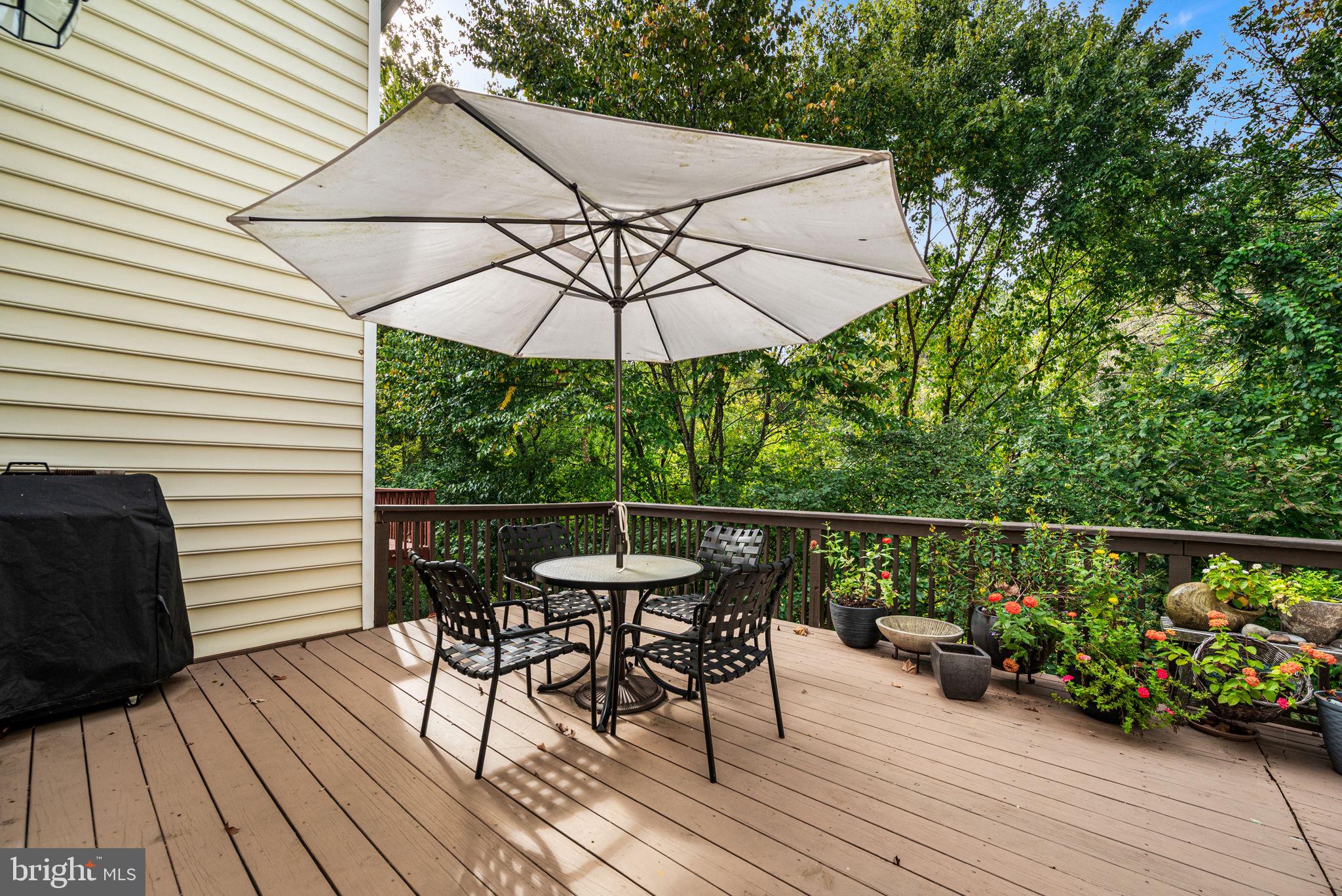 102 Dundee Mills Lane Wallingford, PA 19086 - Photo 18 of 43 an outdoor space with furniture and umbrella