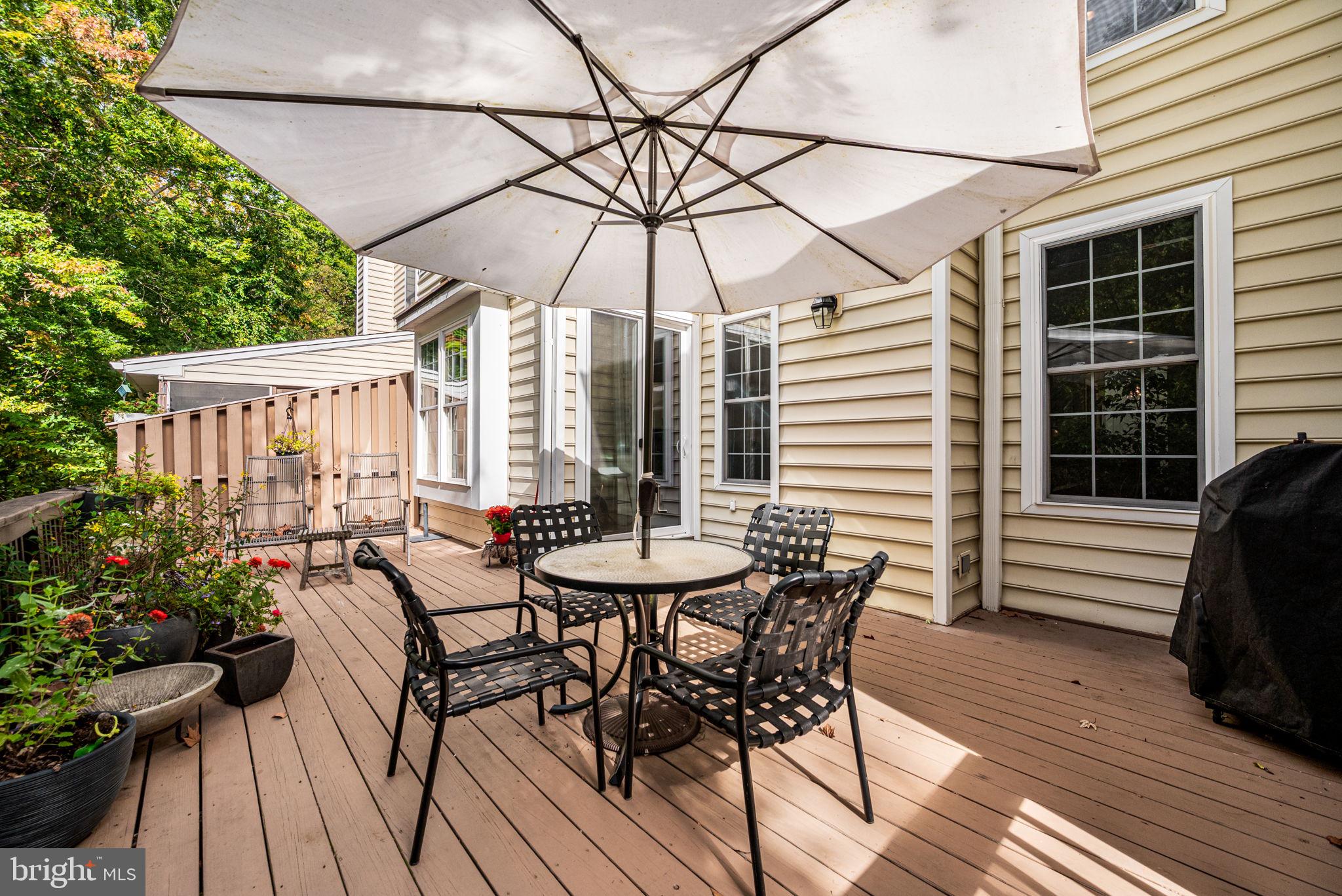 102 Dundee Mills Lane Wallingford, PA 19086 - Photo 20 of 43 a view of a patio with a table and chairs