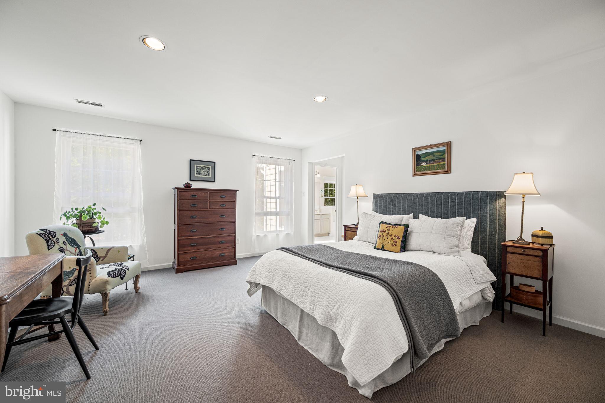 102 Dundee Mills Lane Wallingford, PA 19086 - Photo 22 of 43 a spacious bedroom with a bed and chair