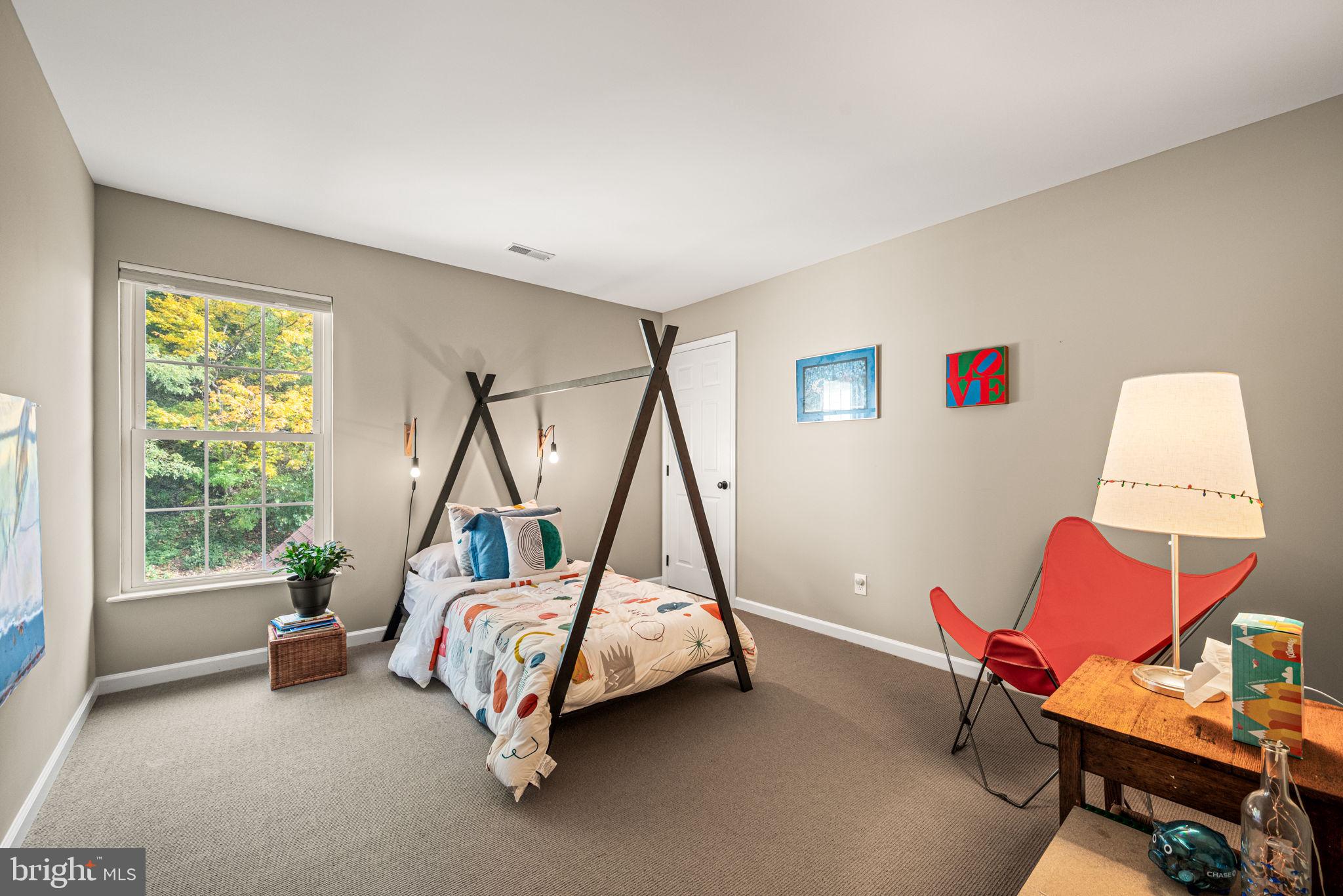 102 Dundee Mills Lane Wallingford, PA 19086 - Photo 27 of 43 a bedroom with furniture and a window