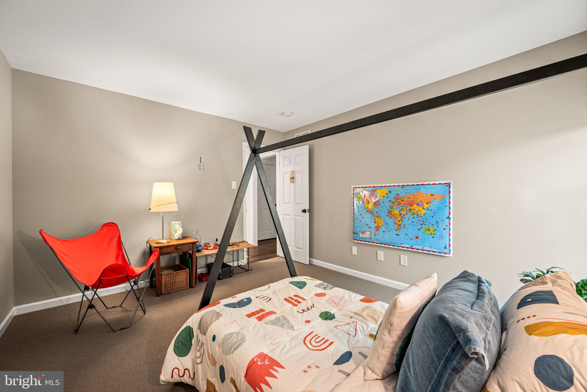 102 Dundee Mills Lane Wallingford, PA 19086 - Photo 28 of 43 a bed room with a bed and a chair