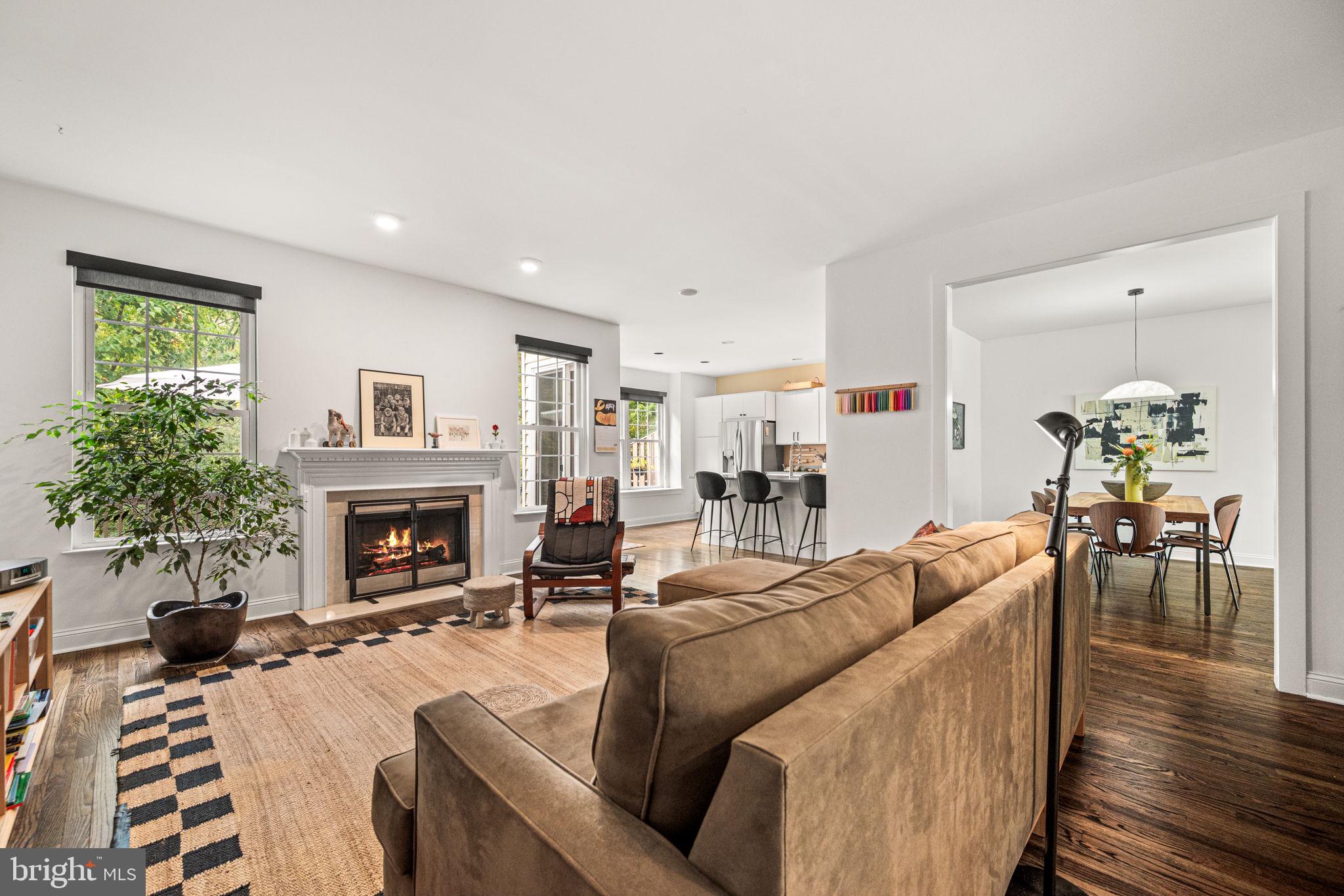 102 Dundee Mills Lane Wallingford, PA 19086 - Photo 43 of 43 a living room with furniture a fireplace and a potted plant