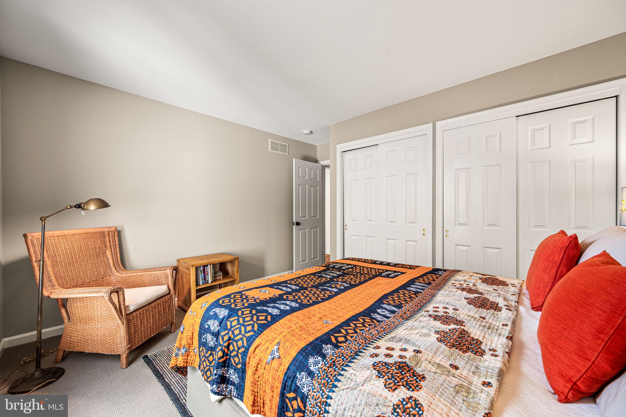 102 Dundee Mills Lane Wallingford, PA 19086 - Photo 30 of 43 a bedroom with a bed and chair