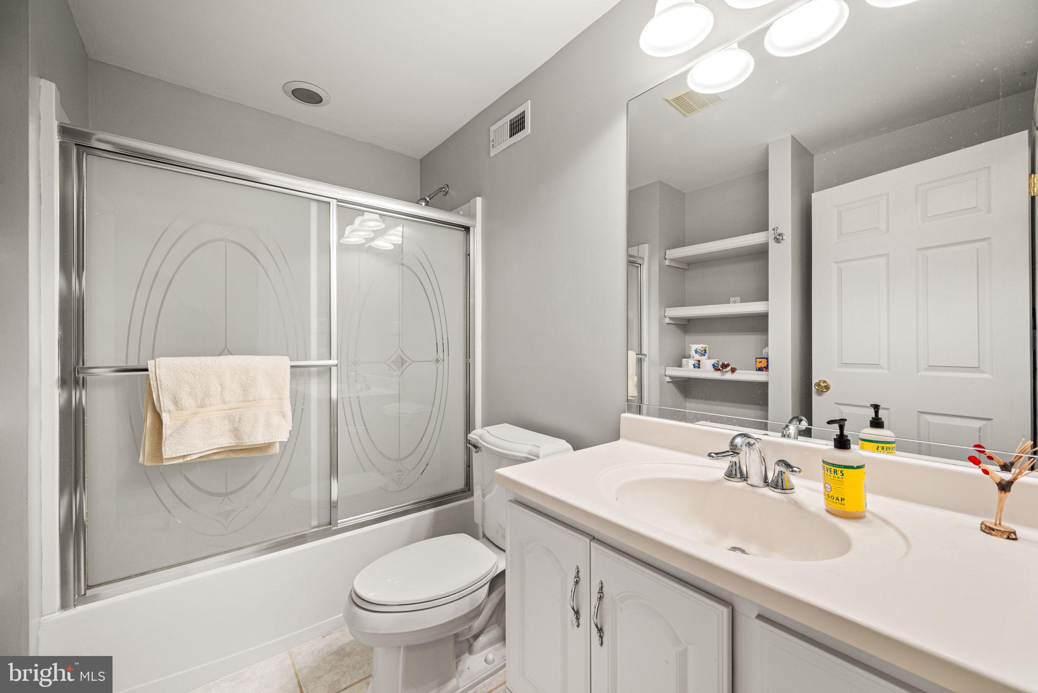 102 Dundee Mills Lane Wallingford, PA 19086 - Photo 38 of 43 a bathroom with a sink a toilet and shower