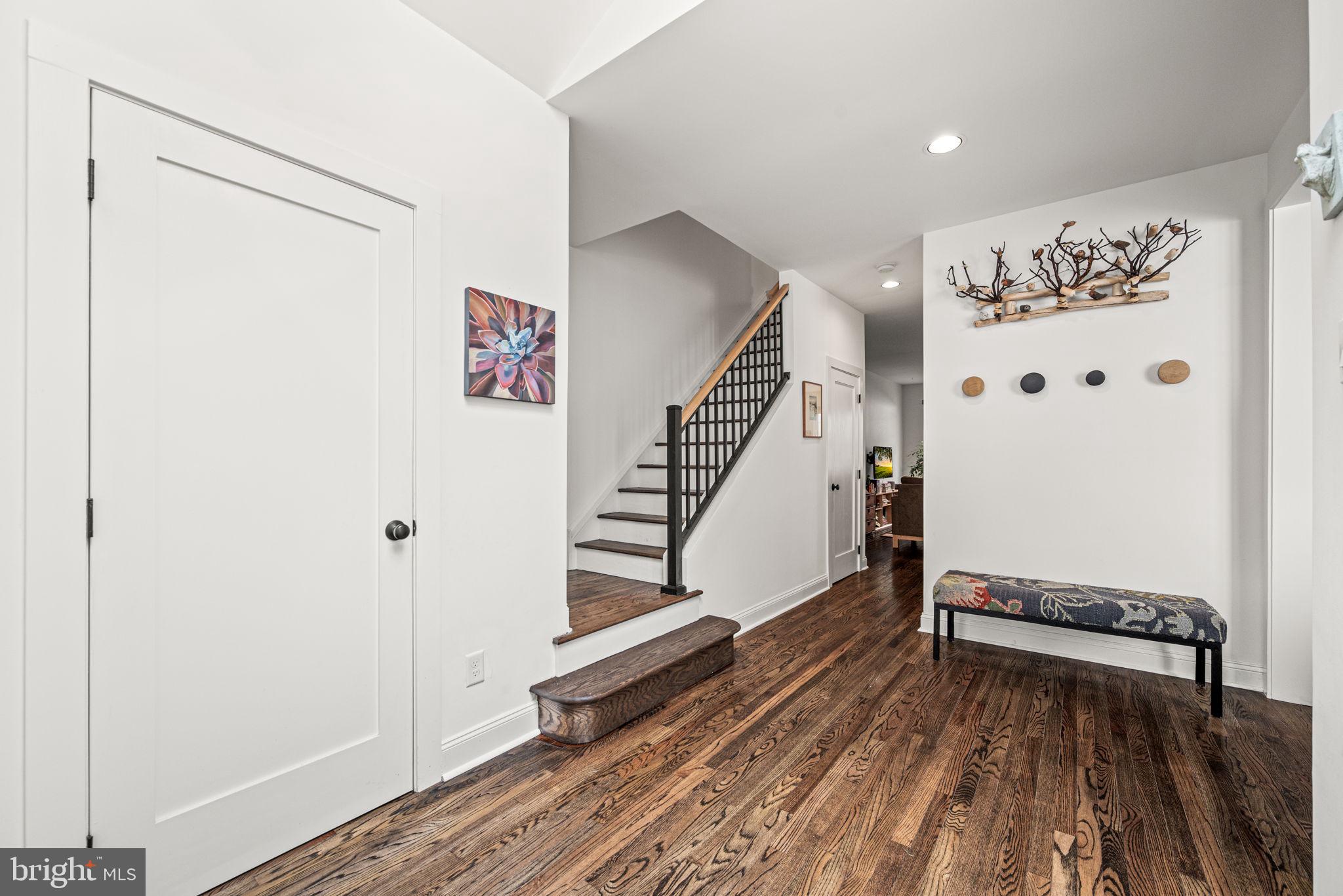 102 Dundee Mills Lane Wallingford, PA 19086 - Photo 3 of 43 a view of a hallway with wooden floor and staircase