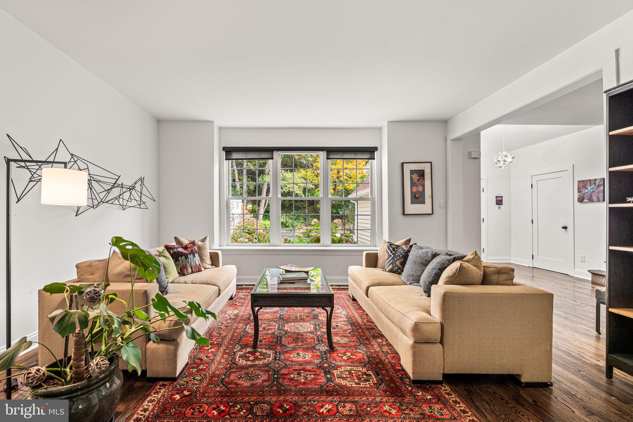 102 Dundee Mills Lane Wallingford, PA 19086 - Photo 7 of 43 a living room with furniture and a large window