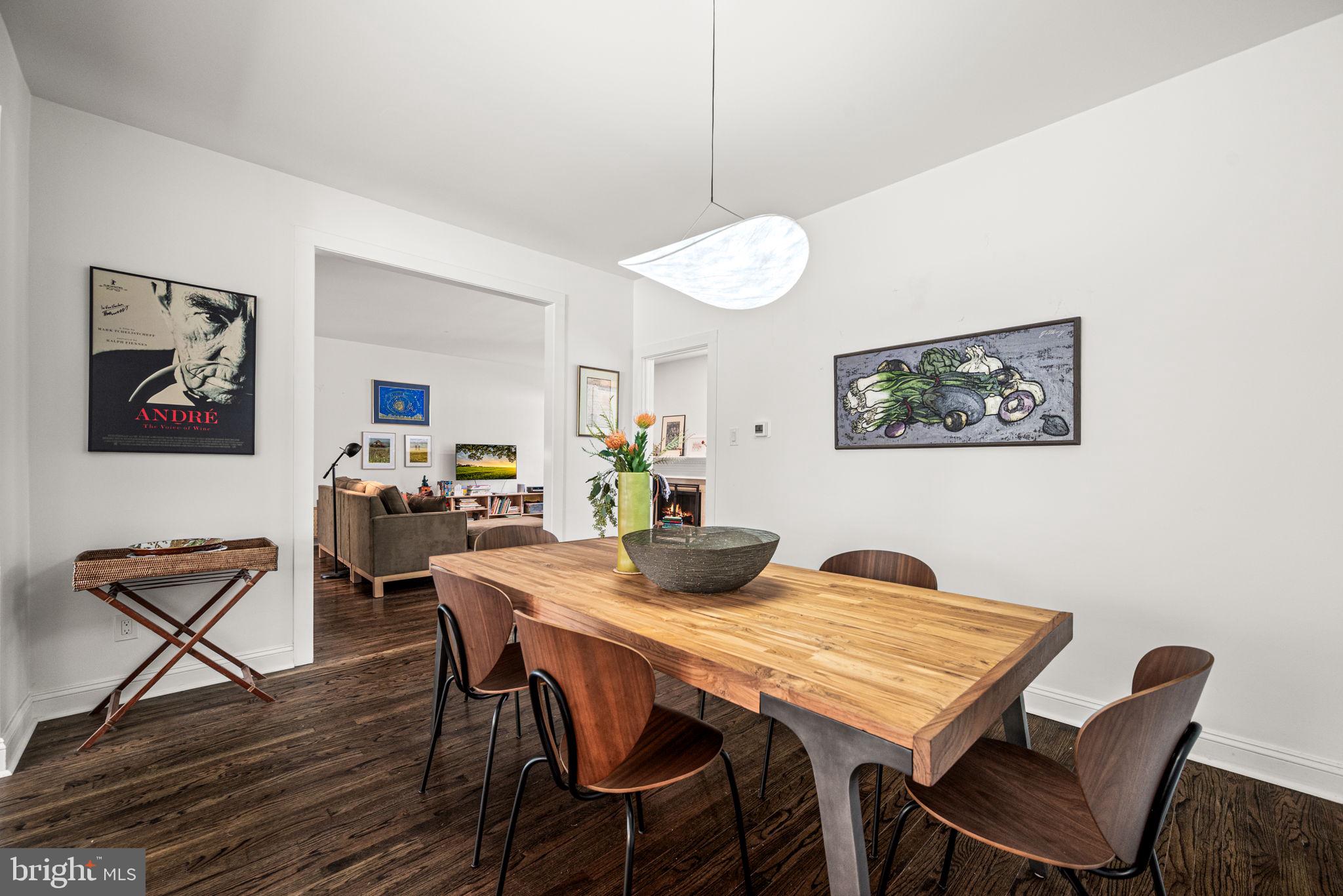 102 Dundee Mills Lane Wallingford, PA 19086 - Photo 8 of 43 a view of a dining room with furniture and wooden floor