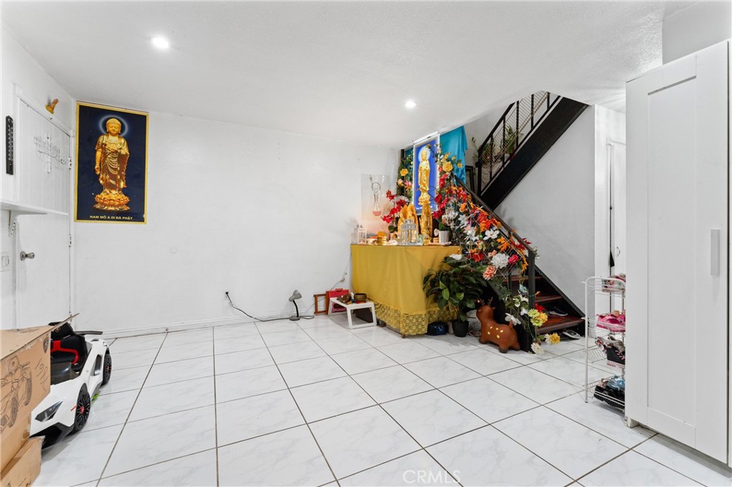 3927 West McFadden Avenue, Unit B Santa Ana, CA 92704 - Photo 4 of 14 a view of a room with gym equipment