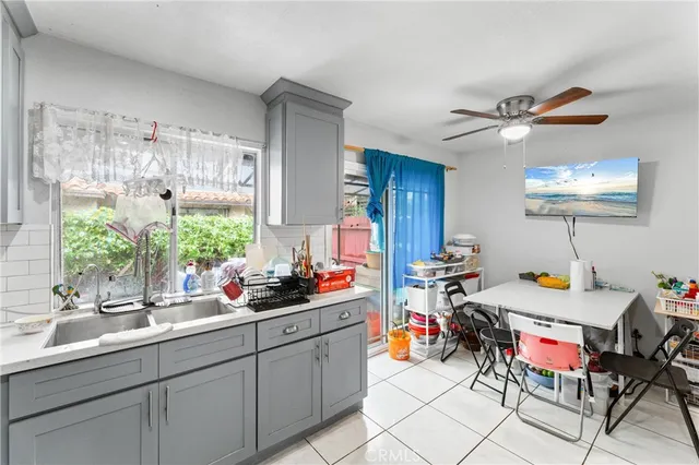 a kitchen with a sink and cabinets