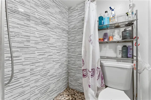 a bathroom with a toilet and a sink