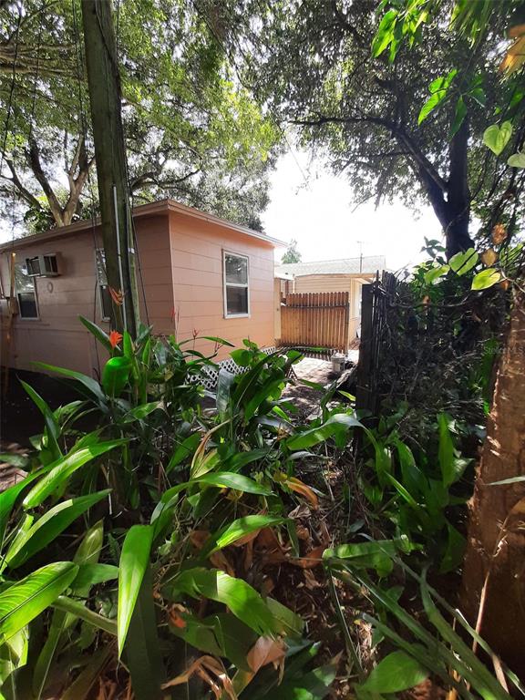 2553 52nd Avenue North St. Petersburg, FL 33714 - Photo 1 of 6 a backyard of a house with lots of green space